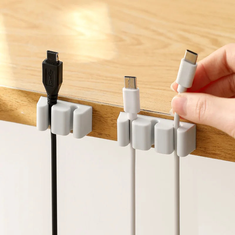 📋 Title:
Desktop Cable Organizer Silicone Cable Holder Clips Cord Wire Management Self Adhesive USB Cable Winder for Home Office (2 PCS)